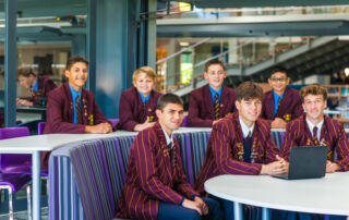 Holy Cross College Ryde students sitting in a class school